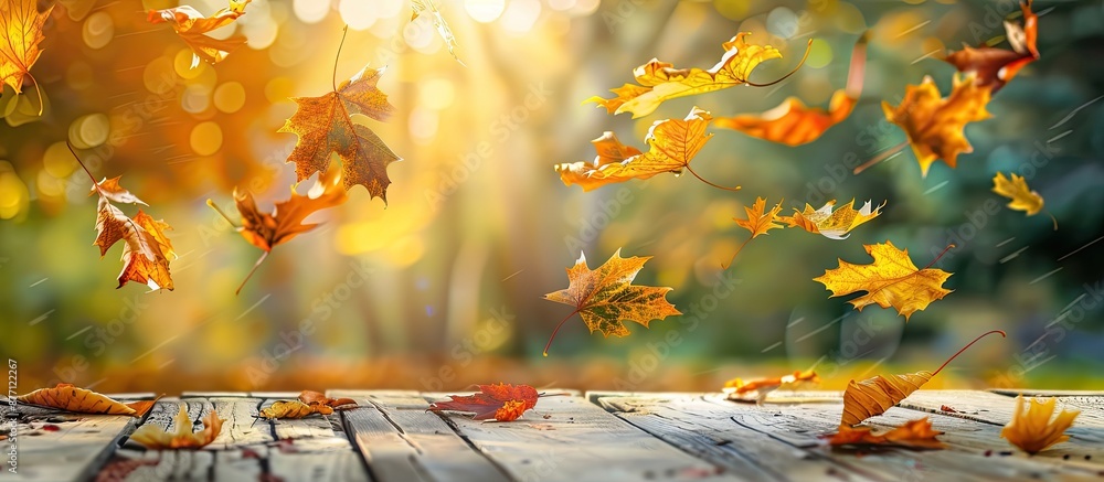 Poster autumn maple leaves on a wooden table create a falling leaves natural background with copy space ima