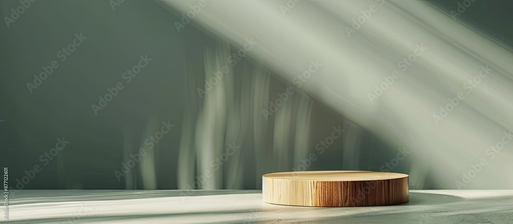Aufkleber minimalistic wooden podium placed on a pale green backdrop with interplay of light and shadows creat