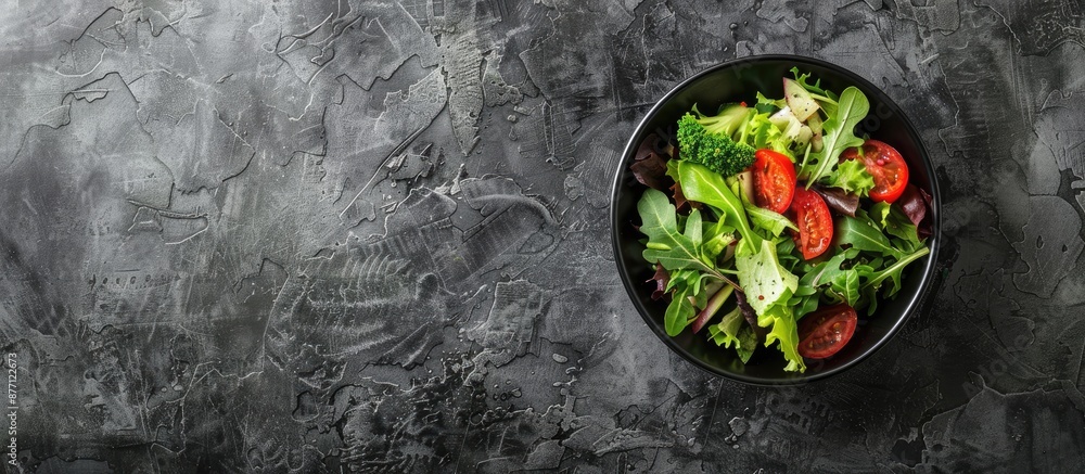 Poster Top view of a fresh salad bowl on a stone surface, with room for additional text or images in the frame.
