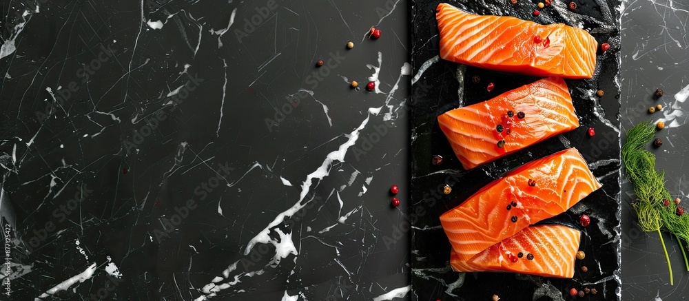Poster fish delicacy arranged in a flat lay composition with fresh raw salmon on a black marble table, acco