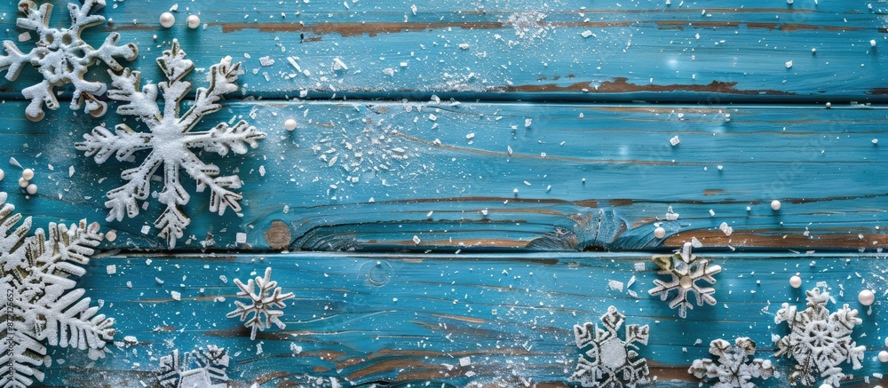 Aufkleber Vintage blue wooden boards adorned with Christmas snowflake decorations create a charming holiday postcard frame, perfect for displaying your text and design against a copy space image.