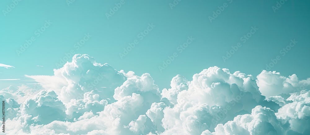 Poster copy space image of a pure environment concept with a turquoise sky, white fluffy clouds drifting sm