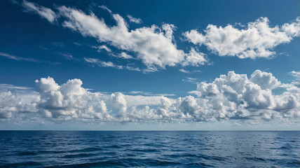 Obraz premium a beautiful blue sea background, blue sea, sea background, sea with white cloud, nature background, water of sea