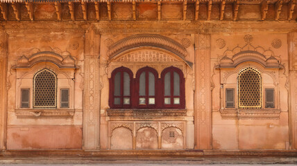 Beautifully designed windows of Nand Bhawan, the meeting hall, Deeg Palace, Deeg, Rajasthan, India.