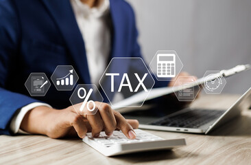 Tax and Vat concept. Government, state taxes concept. Businesman using calculator and laptop to...