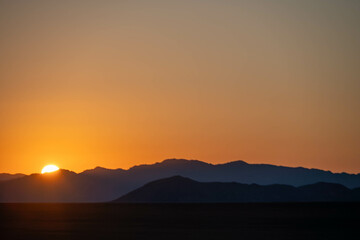 sunrise over the mountains and sand dunes of sossusvlei, namibia