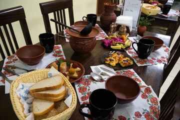 Traditional Ukrainian food on the table in clay dishes.