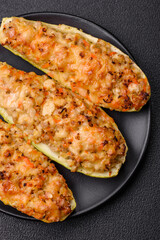 Zucchini halves baked with cheese, tomatoes, meat or meat substitute