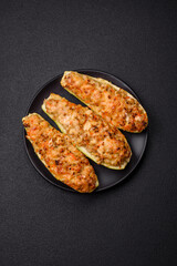 Zucchini halves baked with cheese, tomatoes, meat or meat substitute