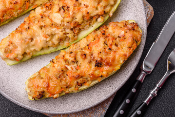 Zucchini halves baked with cheese, tomatoes, meat or meat substitute