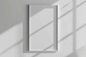 White rectangular vertical frame hanging on a white wall mockup. Clear design mock up template reflection, shadow overlay