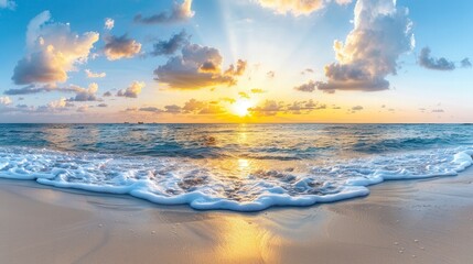 Obraz premium Breathtaking sunrise over the ocean waves, with golden sunlight reflecting on the water and soft clouds floating in the sky.