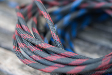 Coiled black and red braided cables