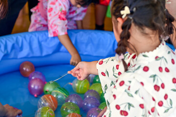 Yo-yo fishing - a Japanese summer festival game for kids also known as yo-yo tsuri