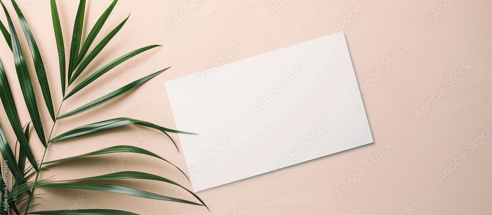 Poster Minimalist top view mockup featuring a white invitation discount card or business card with a leaf design ideal for showcasing with ample copy space image