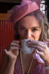 Flapper dress 1920 lady closeup with tea