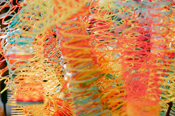 Lots of bright colorful spirals. Abstract blurred background with selective focus on waves. High...