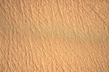 Beach sand background. Top view of a beach sand background with natural wave pattern