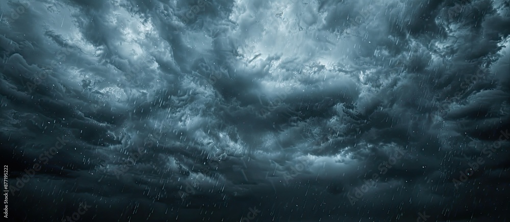 Poster Rainy dark sky with clouds and sparse sunlight creating a sky background suitable for copy space image
