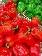Fresh Red and Green Bell Peppers in Market