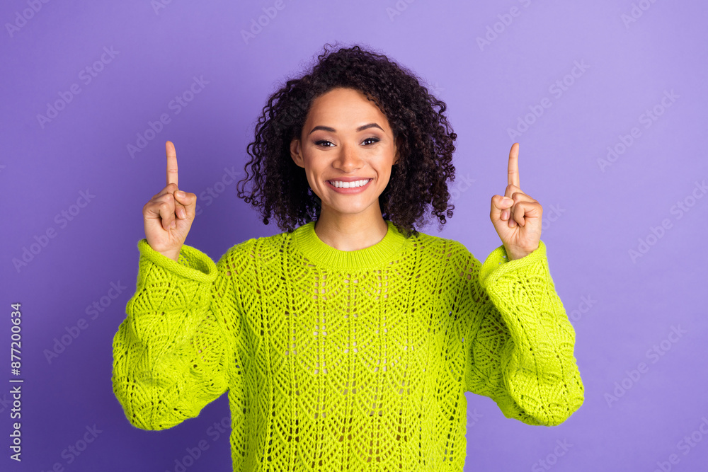 Canvas Prints Photo of charming girl in bright yellow knitted sweater indicating fingers above mockup subscribe media channel isolated on purple color background