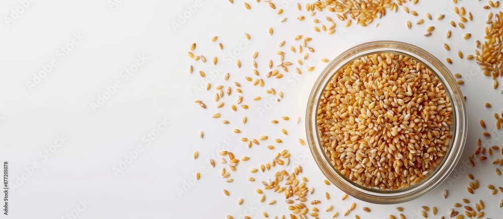 Fototapete Plastic container holding raw bulgur grain a nutritious whole wheat cereal displayed over white backdrop with ample copy space image for customizing