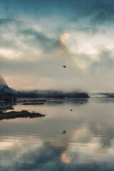 Milford Sound or Rahotu with Mitre peak in foggy on the lake at New Zealand