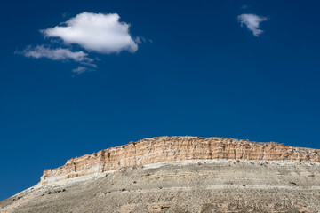 Blue sky and barren mountain landscape