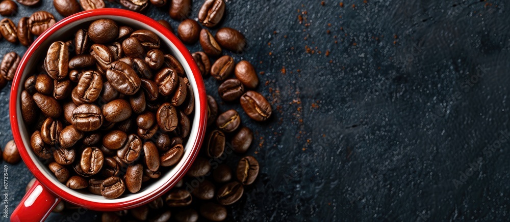 Poster roasted coffee beans in a red coffee cup with a white border on a black background with copy space i