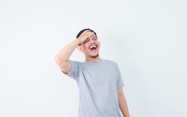  Asian man showing stress gesture with hand touching forehead. mental health and welness.
