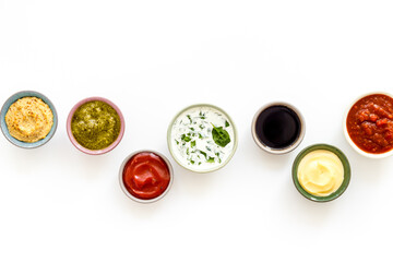 Bowls with various sauces for the meat or vegetables. Food background