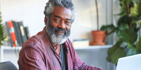 Senior businessman who reads on laptop for office planning, research, and problem-solving. Older person or entrepreneur with workplace technology for proposal or project