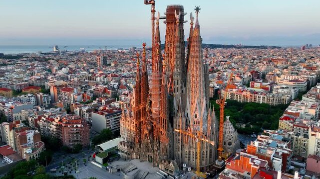 Basilica Sagrada Familia at sunrise in Barcelona, aerial sunrise view of Sagrada familia cathedral in Barcelona, Spain, famous landmark in Barcelona by Antonio Gaudi