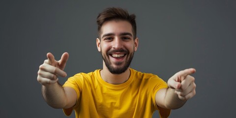 Naklejka premium Happy man portrait pointing to you for choice, decision, and vote for winner, volunteer, or recruiting on white background in studio. Support Indian model, grin, finger, emoji, and join us.