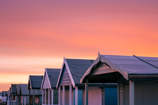Red Sky Over Beach Huts