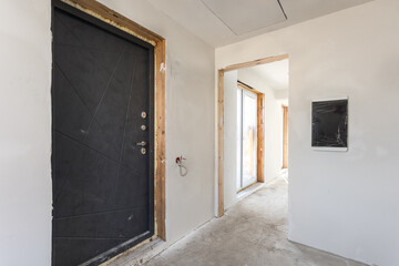 interior of the apartment without decoration in gray colors. rough finish