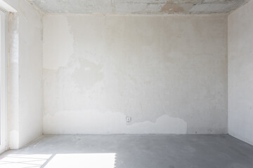interior of the apartment without decoration in gray colors. rough finish