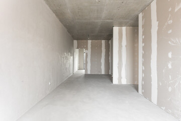 interior of the apartment without decoration in gray colors. rough finish