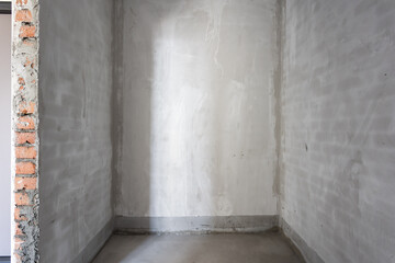 interior of the apartment without decoration in gray colors. rough finish