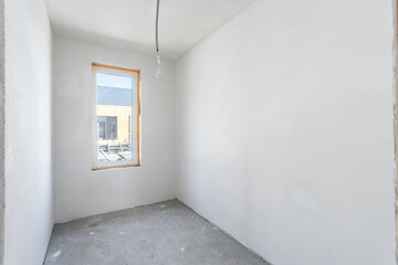 interior of the apartment without decoration in gray colors. rough finish