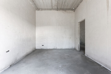 interior of the apartment without decoration in gray colors. rough finish