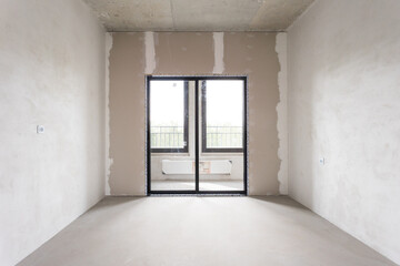 interior of the apartment without decoration in gray colors. rough finish