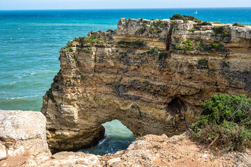 Praia da Marinha Beach among rock islets and cliffs seen from Seven Hanging Valleys Trail, Algarve,...