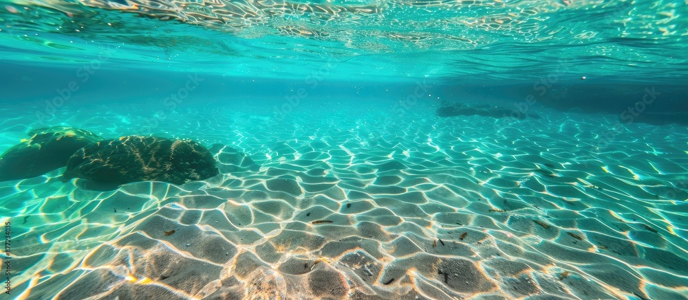 Poster crystal clear water showing the sandy lake floor beneath creating a stunning blue and turquoise back