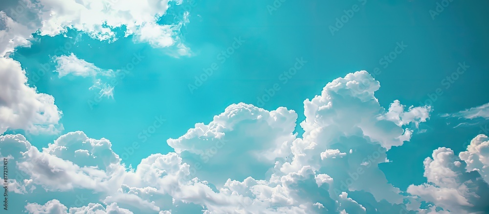 Poster beautiful nature scene featuring clouds floating in a blue sky with serene beauty ideal as a copy sp