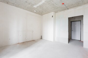 interior of the apartment without decoration in gray colors. rough finish
