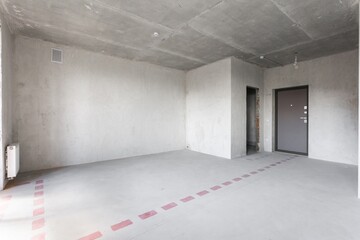 interior of the apartment without decoration in gray colors. rough finish