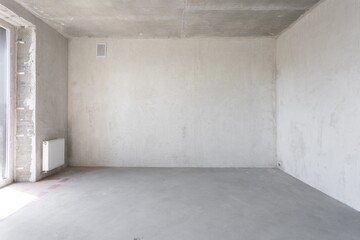 interior of the apartment without decoration in gray colors. rough finish