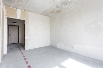 interior of the apartment without decoration in gray colors. rough finish