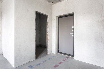 interior of the apartment without decoration in gray colors. rough finish